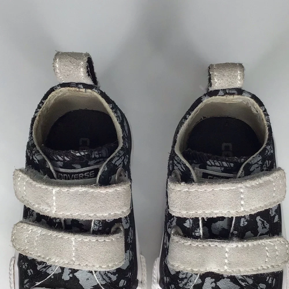 Converse Chuck Taylor All Star 2V Black and Gray Leopard Print Sneakers.